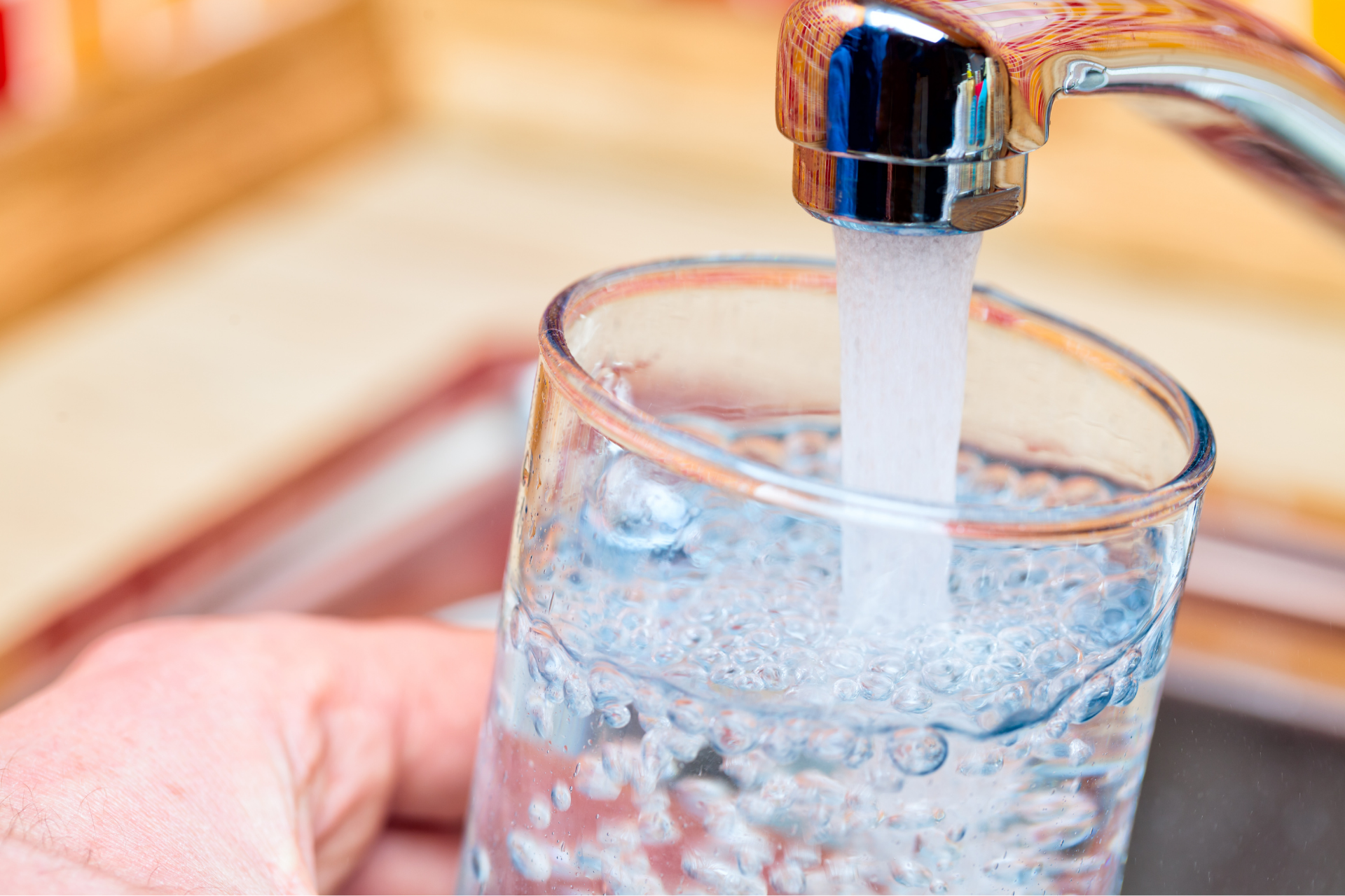 filling glass with tap water