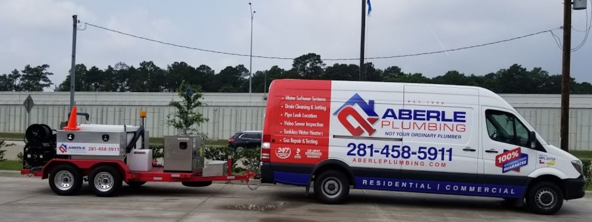 Aberle Plumbing truck carrying hydro-jetting equipment for drain cleaning service.