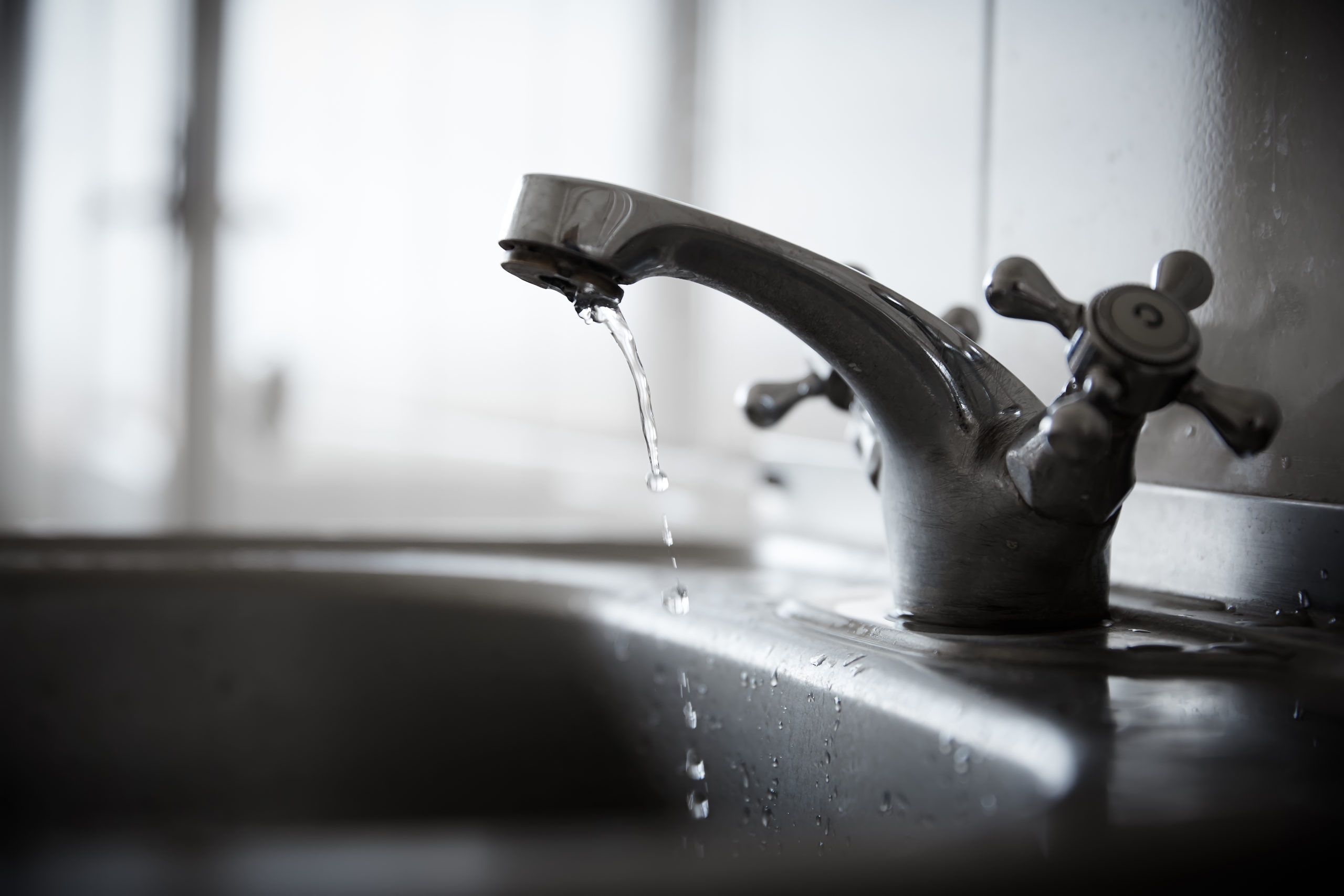 A sink and leaky faucet in a Houston, TX, home.