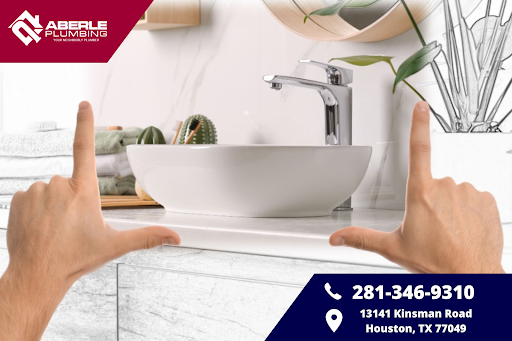 Hands framing a sink for a bathroom renovation.