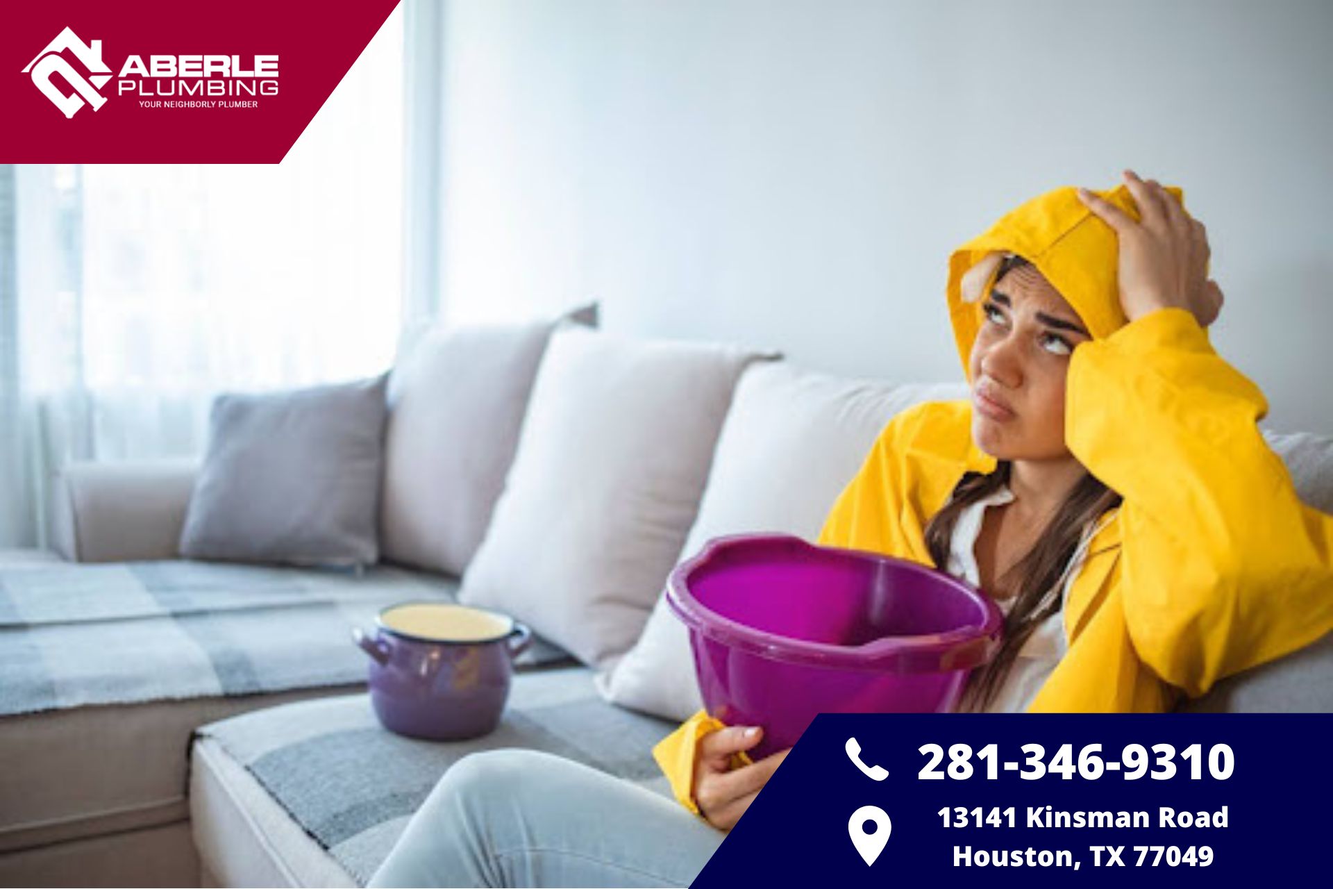 Homeowner sitting on couch with rain jacket on holding bucket to catch water leaking from ceiling.